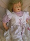 an image of Madame Hendren Dolly Rekord with picture and good luck charm
